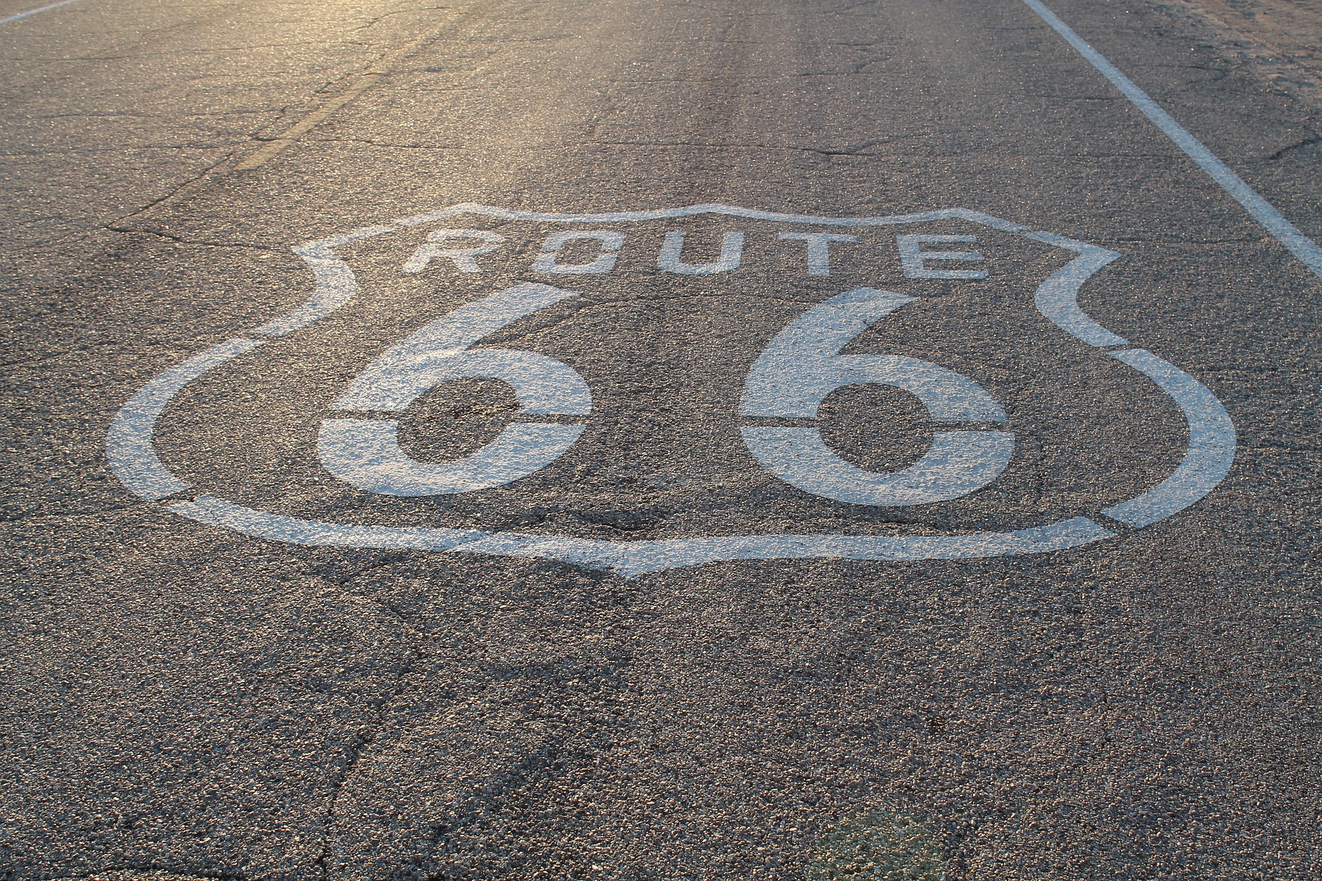 U.S. Route 66 emblem painted on road surface, representing Inland Empire, California.